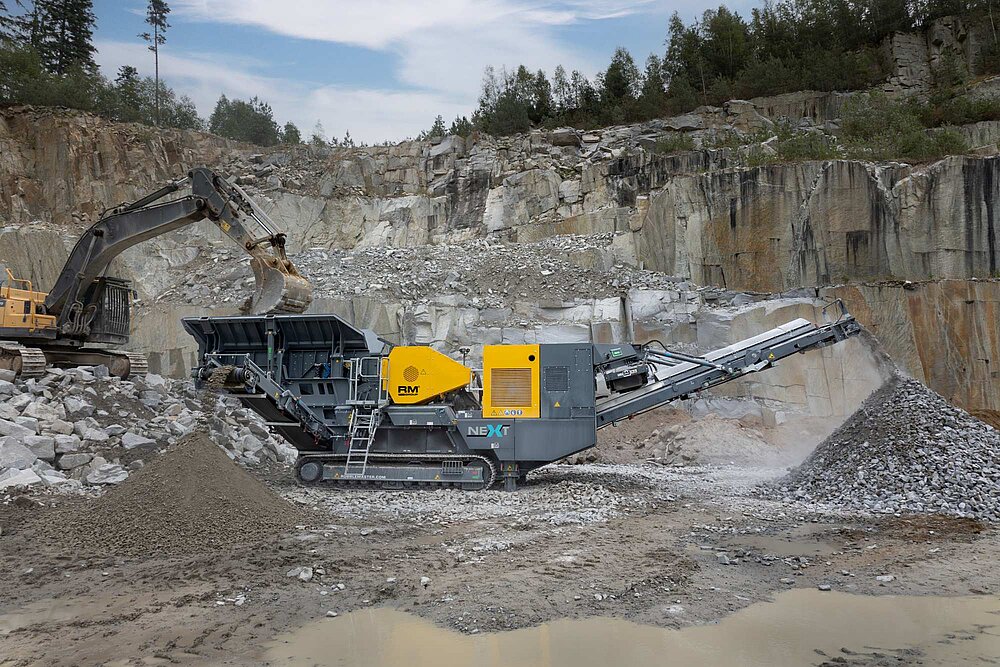 RM J110X tracked jaw crusher crushing granite